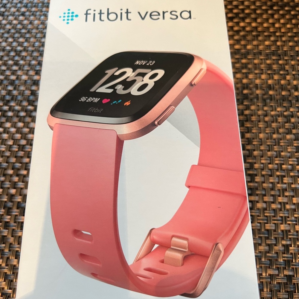 FitBit Versa and 11 multicolored silicone bands